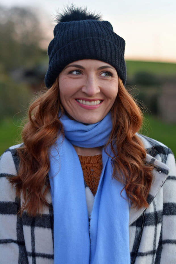 Winter style: Black and white checked coat, blue scarf