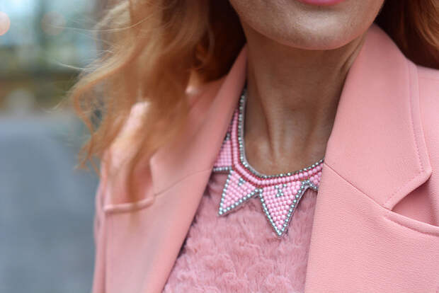 Peach tailored jacket, pink necklace