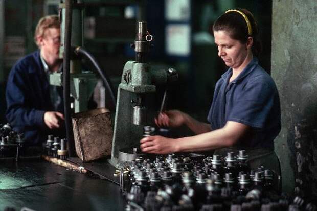 Workers Laboring in an Electronics Factory