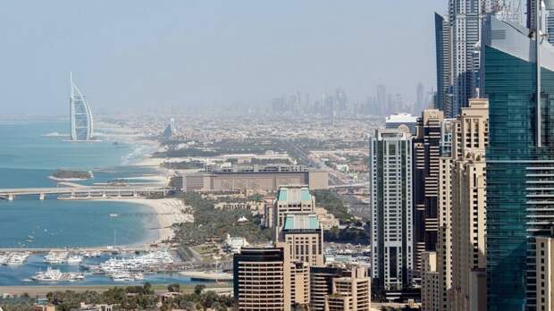 cloud seeding geoengineering Dubai UAE skyline