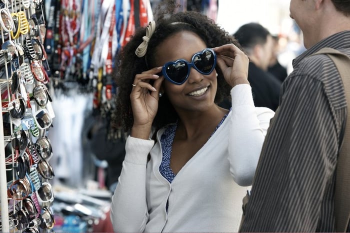 Woman shopping for sunglasses