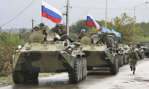A column of Russian troops prepares to leave the checkpoint at a bridge over the Inguri River in Western Georgia