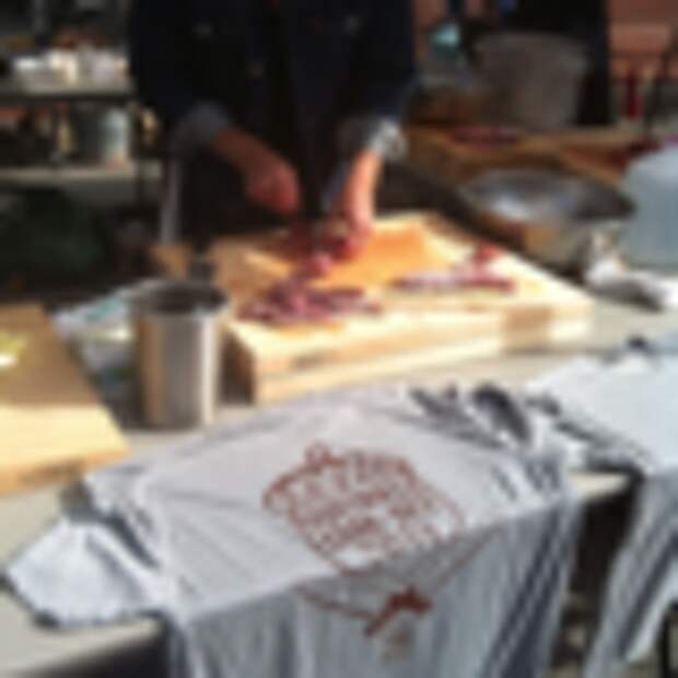 A competitor prepares some squirrel meat.