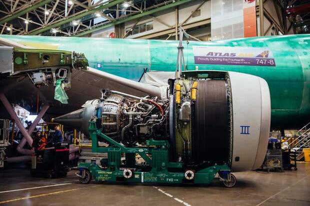 An engine is being fitted onto a 747.