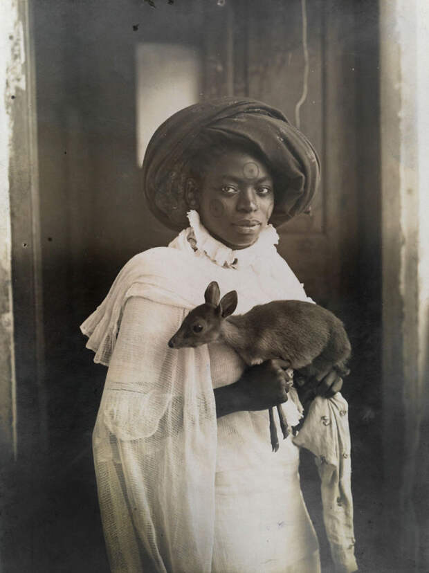 A Young Kenyan Woman Holds Her Pet Deer In Mombassa, March 1909