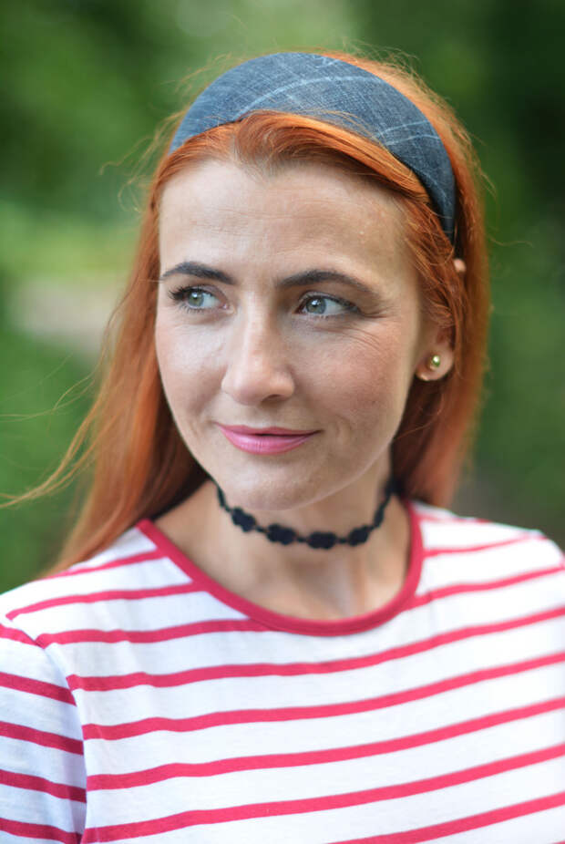 Red striped Breton t-shirt, pink chinos, black 90s-style choker