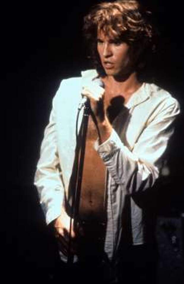 Val Kilmer at the microphone in a scene from the film 'The Doors'