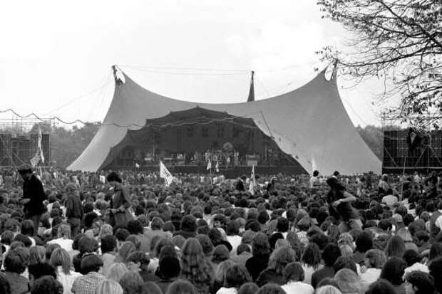 Rock fans gathering for a free concert, given by Queen, after returning to Britain from a world tour. The Hyde Park concert was a way of saying 'thank you' to their British fans.