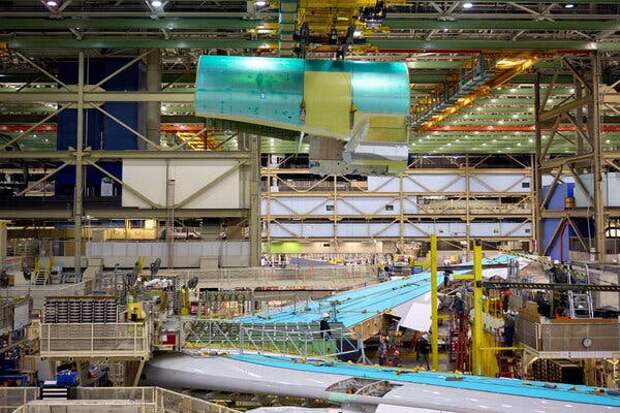 A section of the 747 hangs over the wings.