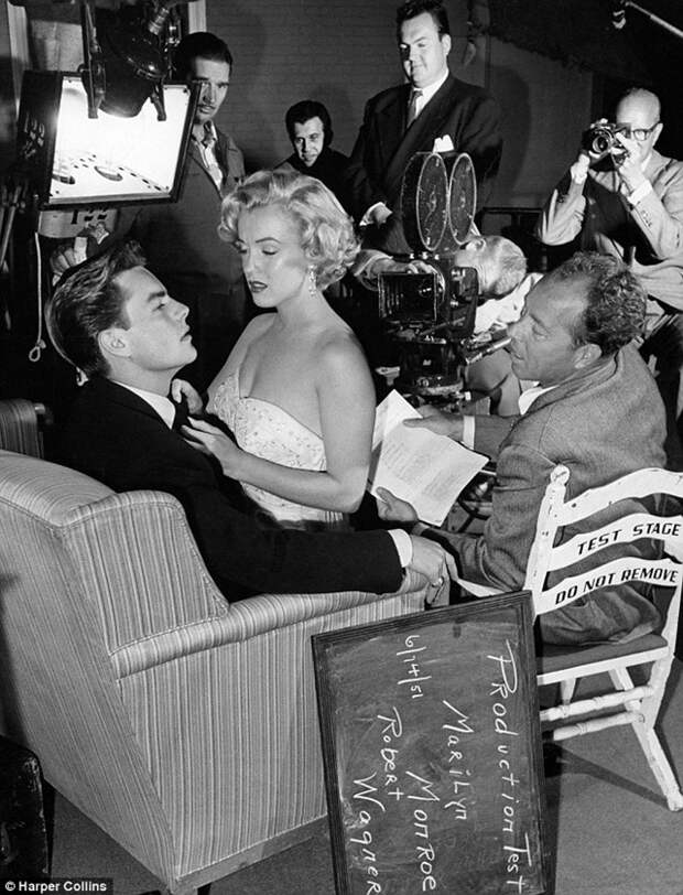 Robert Wagner with a seductive Marilyn Monroe on his lap during a test scene for Let's Make It Legal on June 14, 1951.