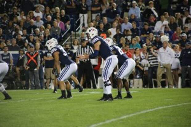 Football players stay up through battle