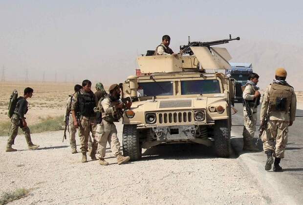 Afghan security forces prepare to check on reports of a possible ambush by the Taliban on the Baghlan-Kunduz highway