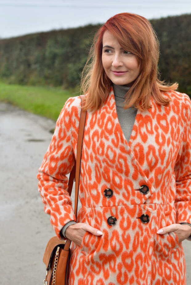 Orange animal print coat, grey roll neck | Not Dressed As Lamb