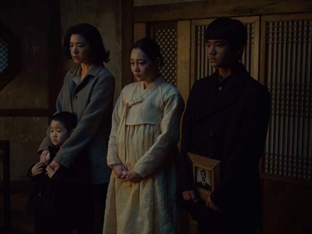 Sunja and her family stand together at funeral
