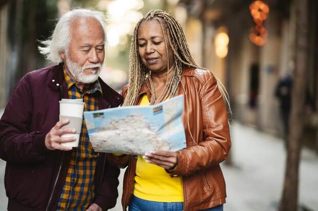 Two people looking at a paper map together.
