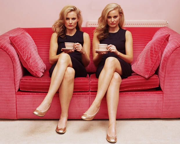 Two women holding cups of tea