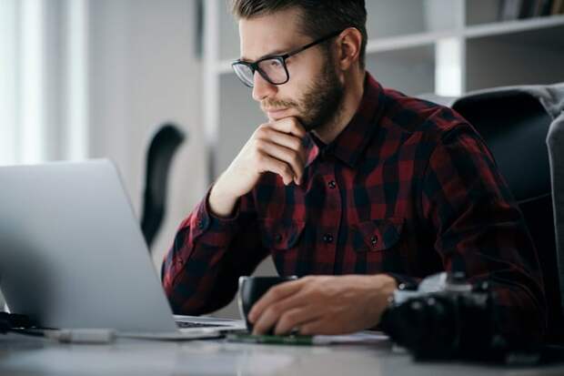 A person looking at a laptop.