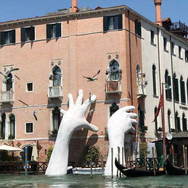 Support: Giant Hands Rise From A Canal In Venice To Send A Powerful Message About Climate Change