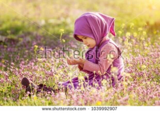 stock-photo-little-muslim-girl-praying-in-the-field-1039992907.jpg