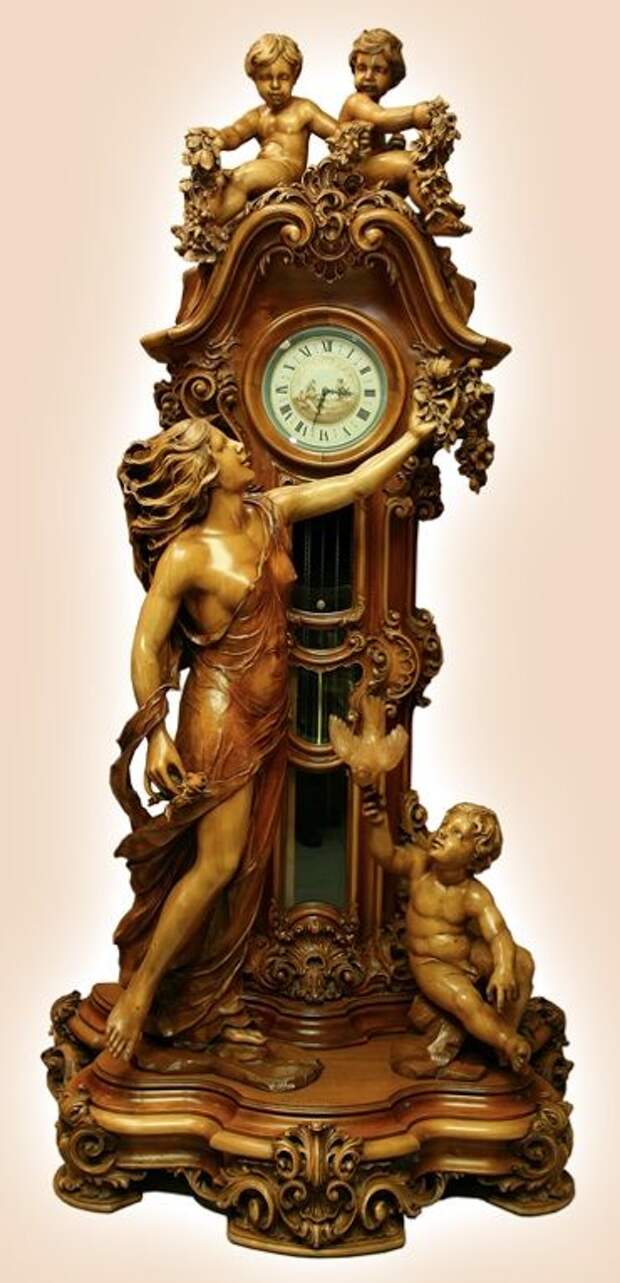 Eternal Love - Timeless Beauty. Hand carved by a master carver from the age of 80-91 years old. It took the artist over eleven years to finish this this timeless piece of art. The clock is carved out of walnut.