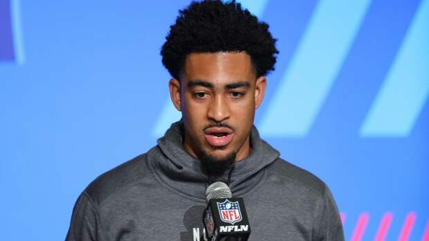 Bryce Young speaks at the podium during the NFL Combine.