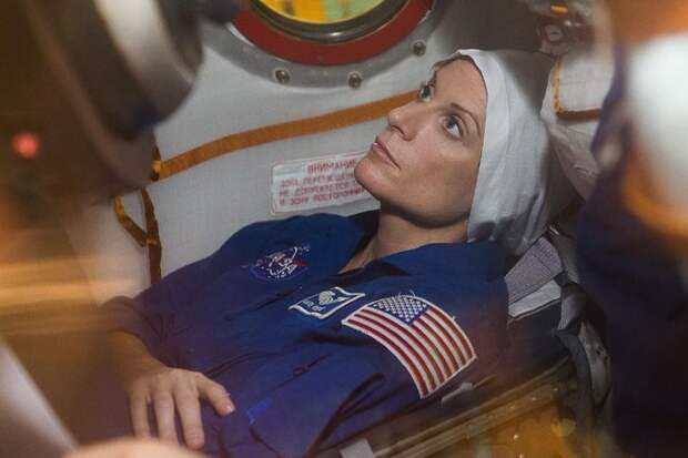 In the Integration Facility at the Baikonur Cosmodrome in Kazakhstan, Expedition 48-49 crew member Kate Rubins of NASA conducts a “fit check” familiarization aboard the Soyuz MS-01 spacecraft June 25 as part of the preparations for launch with Anatoly Ivanishin of Roscosmos and Takuya Onishi of the Japan Aerospace Exploration Agency on July 7, Baikonur time for a planned four-month mission on the International Space Station.