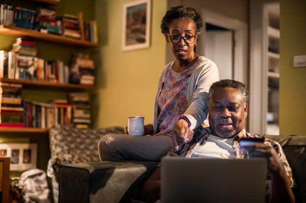 Adults looking at financial paperwork.