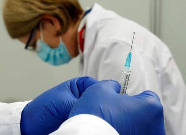 A nurse prepares a dose of Russia's Sputnik V coronavirus disease (COVID-19) vaccine at a sport centre, as the country starts mass inoculation campaign with the Russian vaccine donated by Serbia, in Skopje, North Macedonia April 5, 2021. REUTERS/Ognen Teofilovski