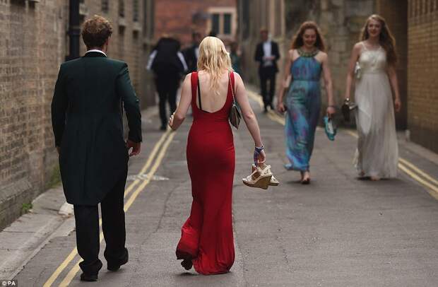 Finishing in style: The streets of Cambridge were filled with glamorous guests as the sun came up on Tuesday morning