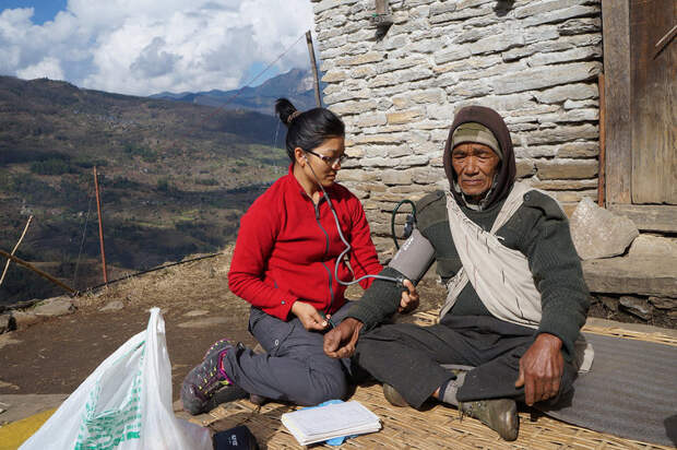 Dr. Sobi Maya Tamang with a patient in a remote village in the Himalayas. 