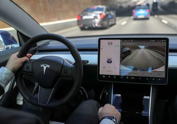 The interior of a Tesla Model 3 electric vehicle is shown in this picture illustration taken in Moscow, Russia July 23, 2020. Picture taken July 23, 2020. REUTERS/Evgenia Novozhenina