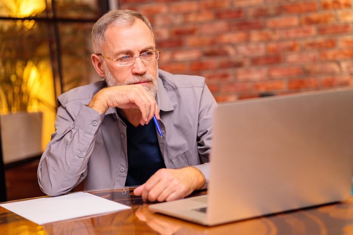 A person at a laptop.