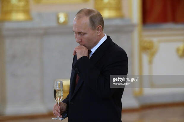 Putin holds a glass