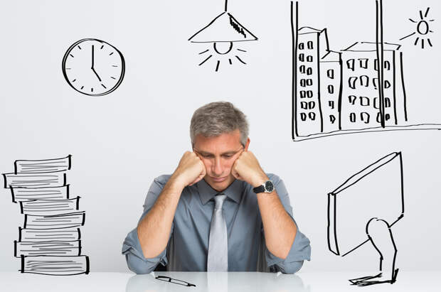 Portrait Of Nervous Businessman Sitting At His Office Desk