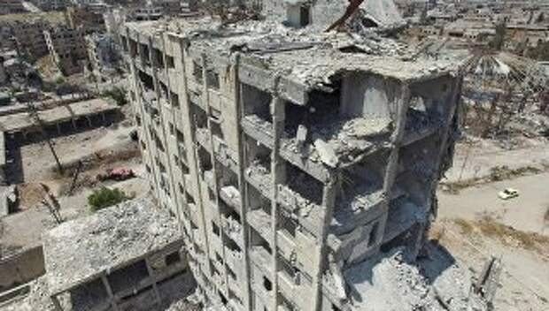Разрушенное здание в квартале Бани-Зейд на севере Алеппо. Архивное фото