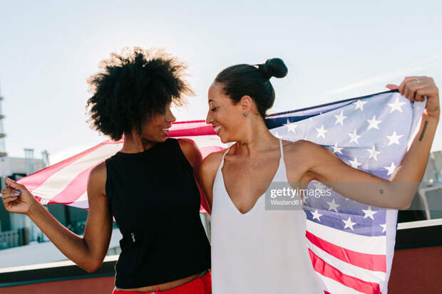 Female holding US flag Female holding US flag
