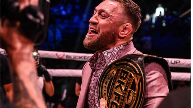 Conor McGregor holding the BKFC belt