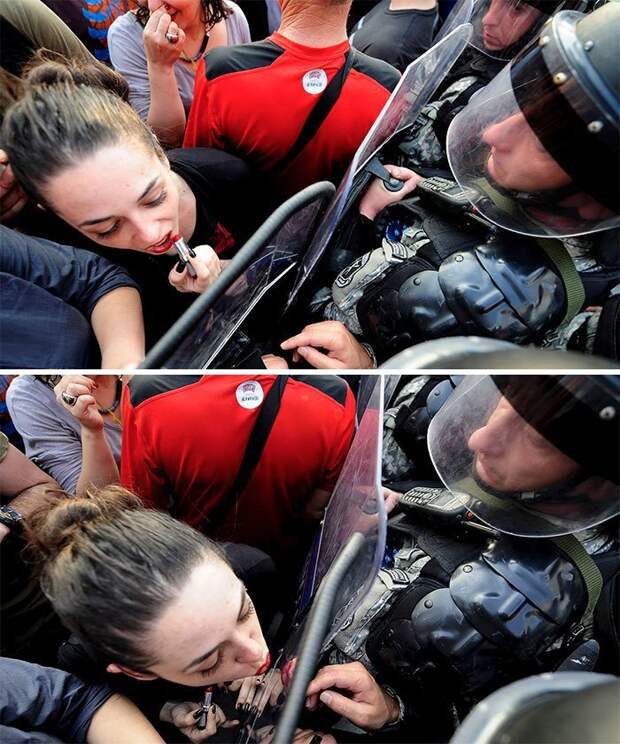Девушка целует щит полицейского во время антиправительственной демонстрации перед зданием правительства Македонии в Скопье, май 2015 демонстрации, женщины, кадры, общество, протест, сильные женщины, сильные фотографии, фото