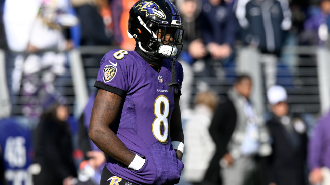 Lamar Jackson walks onto the field.