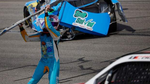 NASCAR driver Joey Gase throwing a bumper at Dawson Cram