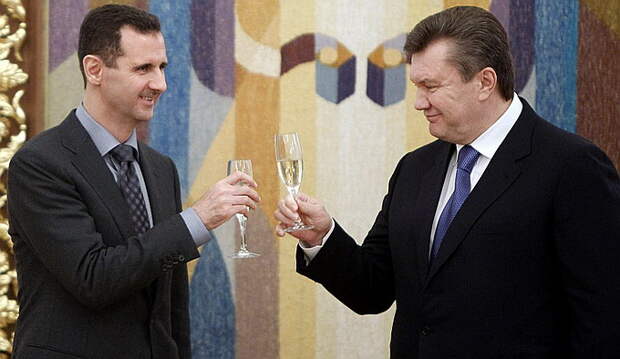 245236-ukraines-president-viktor-yanukovich-toasts-with-syrias-president-bash