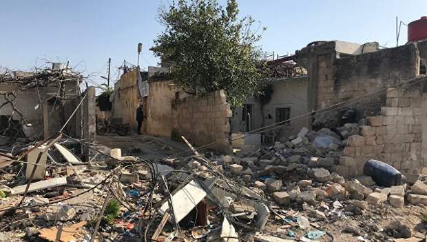 Последствия обстрела турецкими военными поселения Дженджерес в кантоне Африн на севере Сирии. Архивное фото