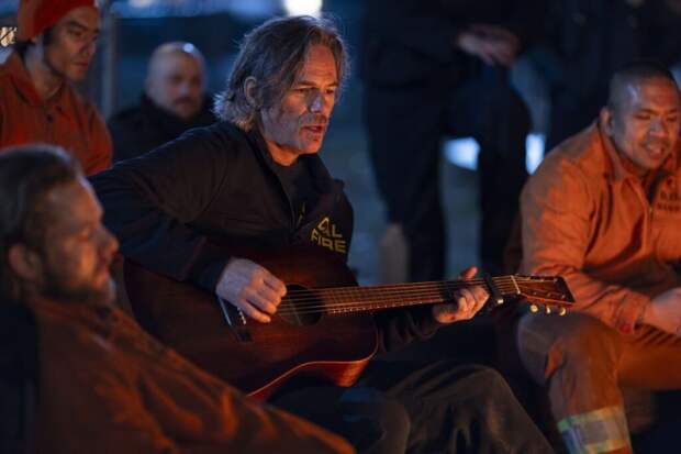 Vince entertains the fire camp with a song - Fire Country