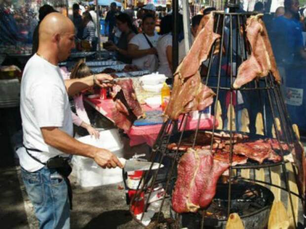 man-grilling-meat-610x458