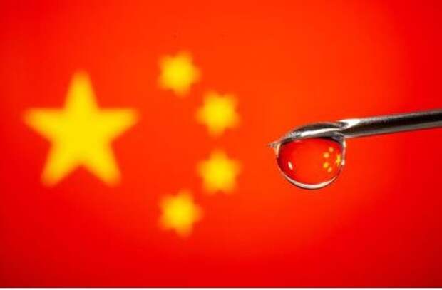 China's flag is reflected in a drop on a syringe needle in this illustration taken November 9, 2020. REUTERS/Dado Ruvic/Illustration