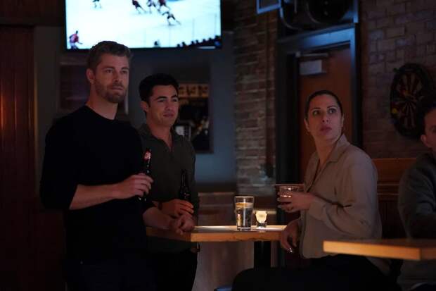 Doris, Frost, and Ripley look at something in the distance while at a bar on Chicago Med Season 10 Episode 7