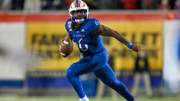 Jalon Daniels scrambles for yardage during Kansas's bowl game vs. Arkansas.