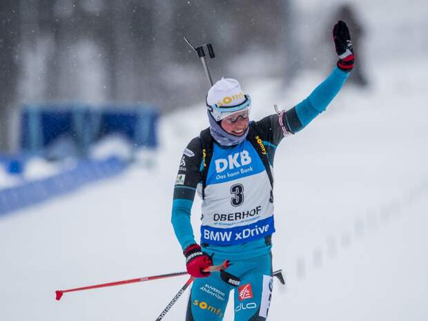 Marie Dorin Habert of France celebrates after winning the women's 10 km pursuit race of the IBU Biathlon World Cup in Oberhof, eastern Germany, on January 7, 2017