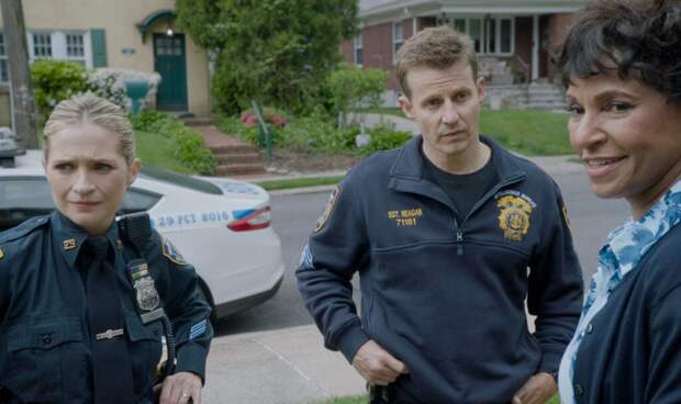 Eddie and Jamie standing outside Badillo's house talking to his mother on Blue Bloods Season 14 Episode 15