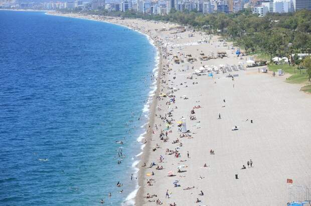 People are seen on a beach in the Mediterranean resort city of Antalya, Turkey, May 19, 2021. (AA Photo)